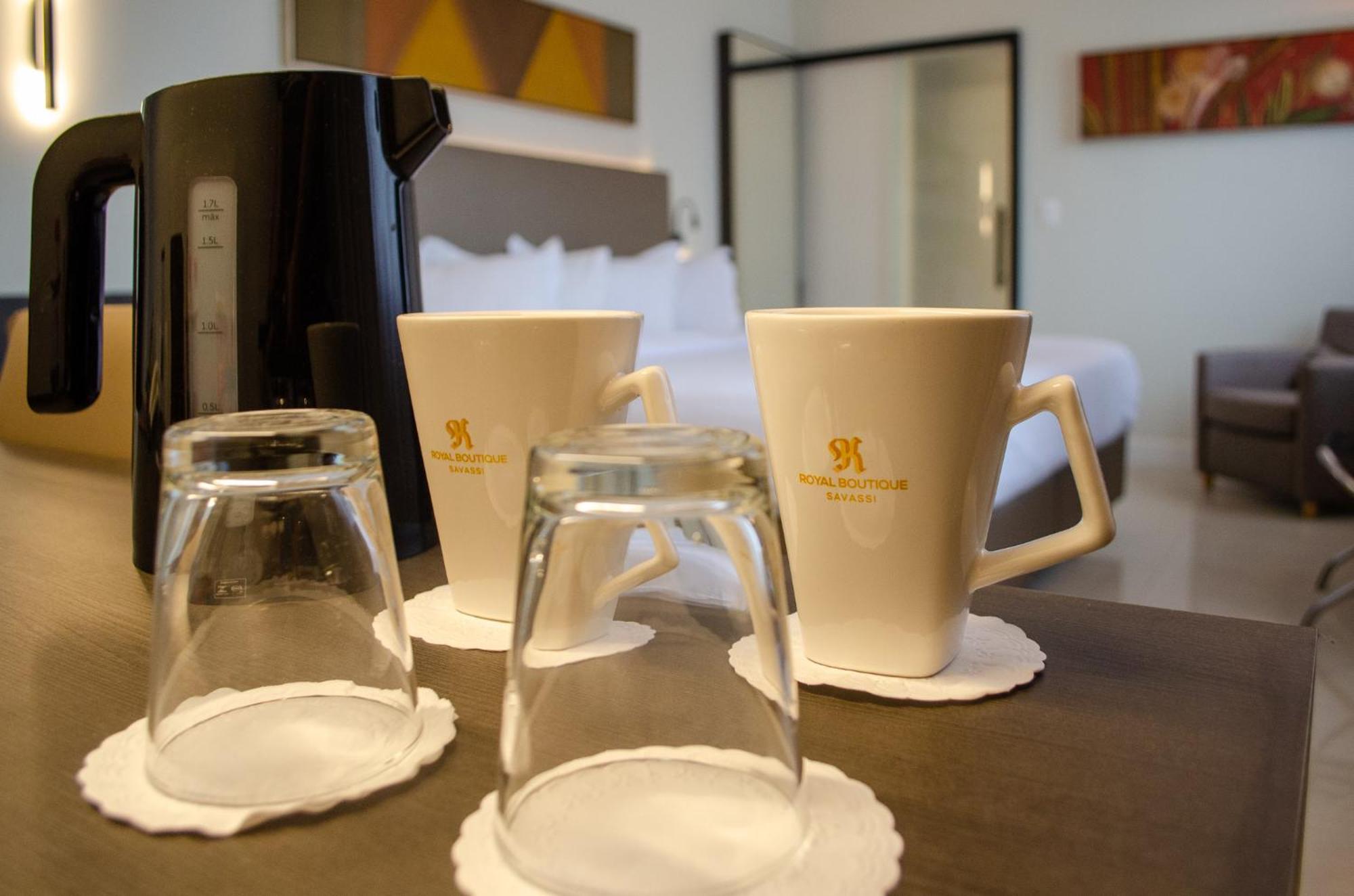 Royal Boutique Savassi Hotel 벨루오리존치 외부 사진 A coffee pot and two cups